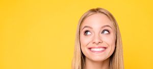 A young woman smiling after cosmetic bonding