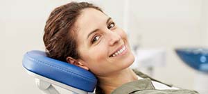 Woman smiling at emergency dental office in Lenox Hill