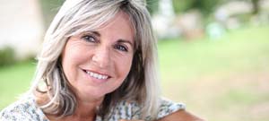 woman with dental implants in Lenox Hill smiling 