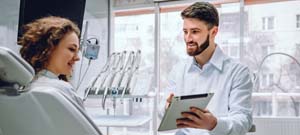 woman at a consultation for dental implants in Lenox Hill 