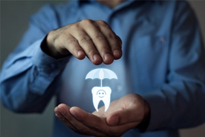 Man holding animated tooth under an umbrella