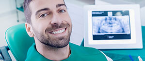 Man with healthy smile after periodontal therapy