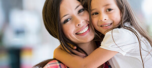 Mother and daughter smiling after dental treatment