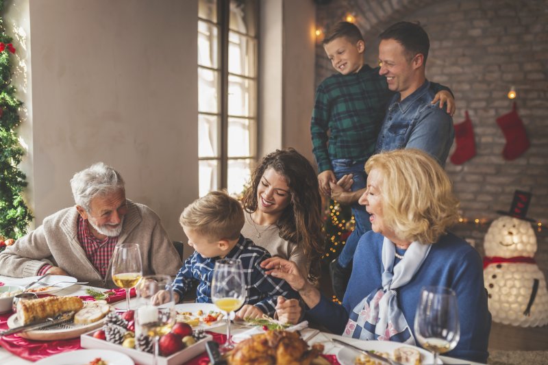 A family sitting down for holiday dinner.